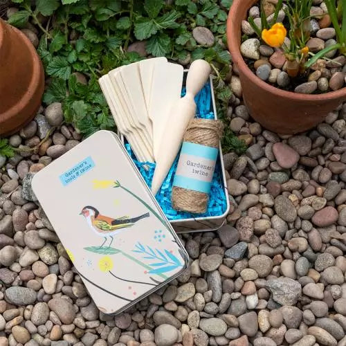 Gardener's tools and twine in a tin