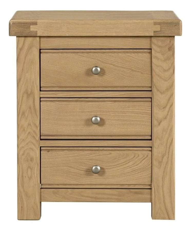 Wooden nightstand with three drawers on a white background