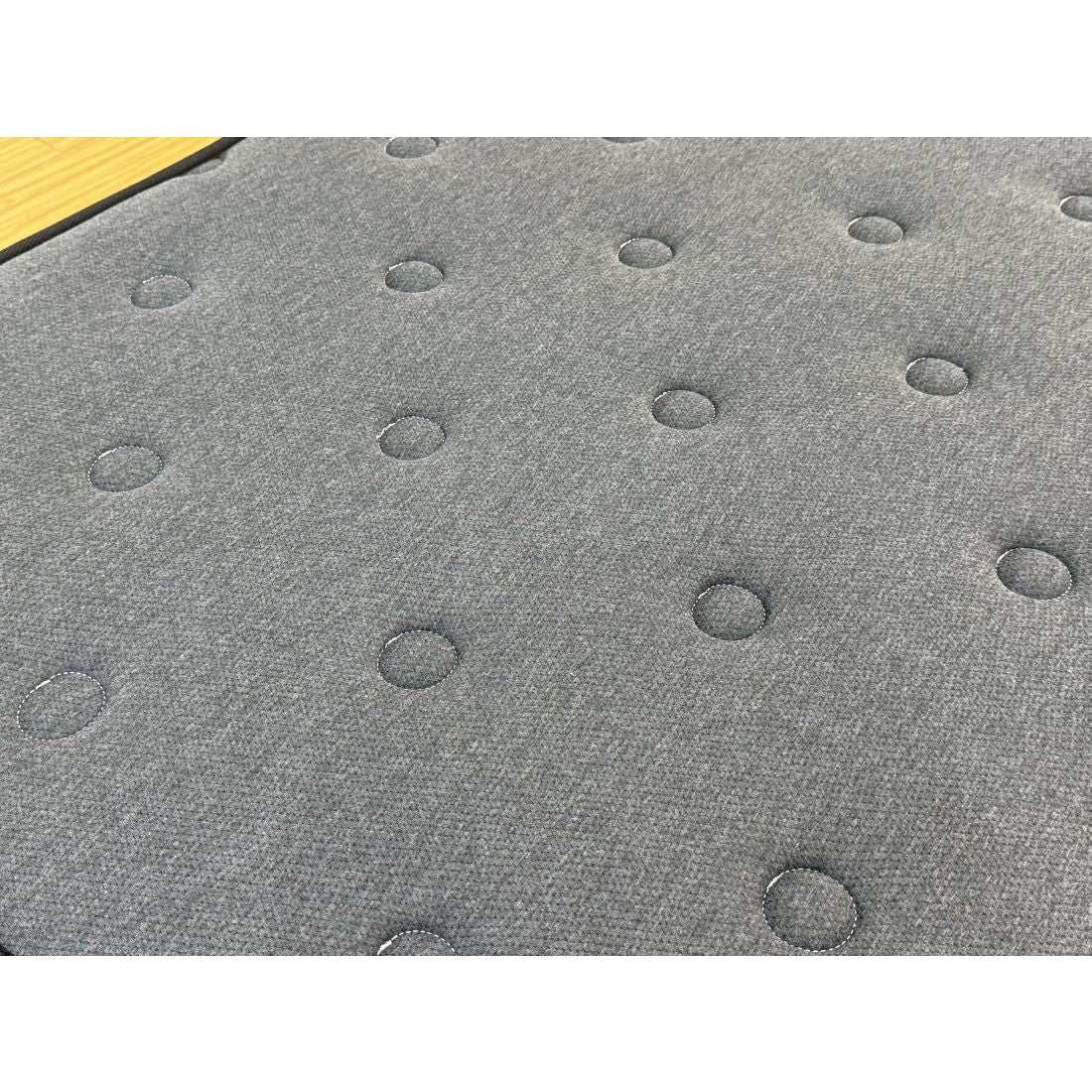 Close-up of a textured gray surface with circular patterns