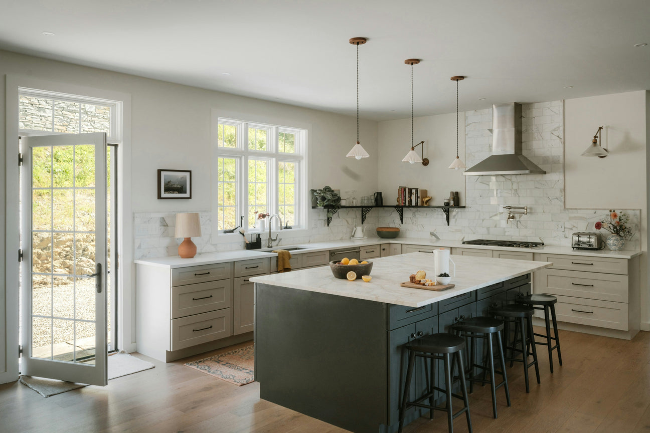 Bright modern kitchen with cookware and utensils for cooking and home living.