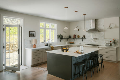 Bright modern kitchen with cookware and utensils for cooking and home living.
