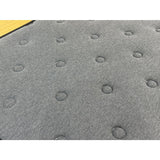 Close-up of a textured gray surface with circular patterns