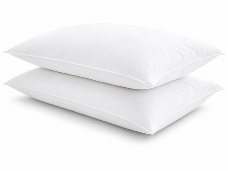 Two white pillows stacked on a light gray background